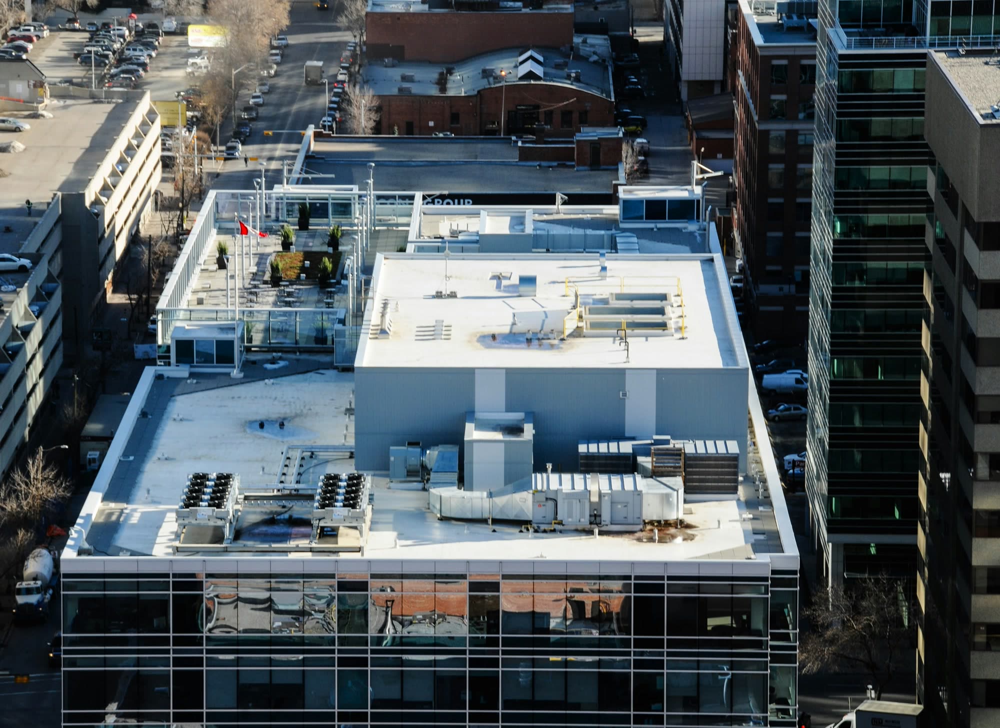 White membrane roof with rooftop units on a commercial building